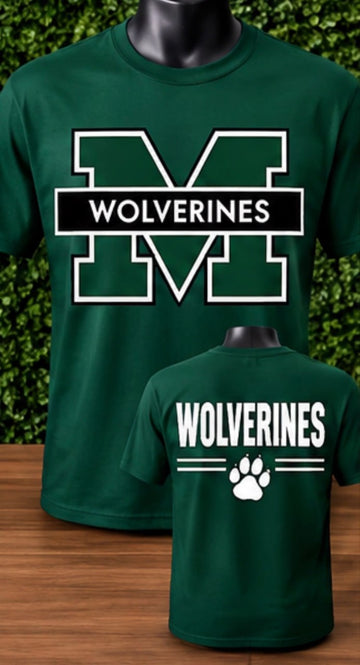Designed with clean athletic lines, this forest green shirt features a framed block letter "M" with "WOLVERINES" on the front chest, complemented by a back print featuring text and a white paw print.